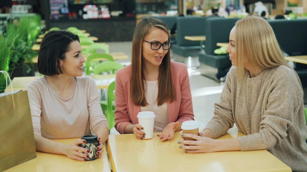 group of people talking in cafe