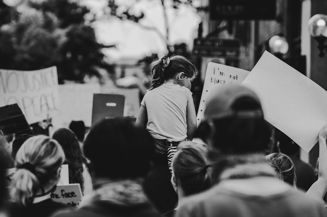 protesters holding signs